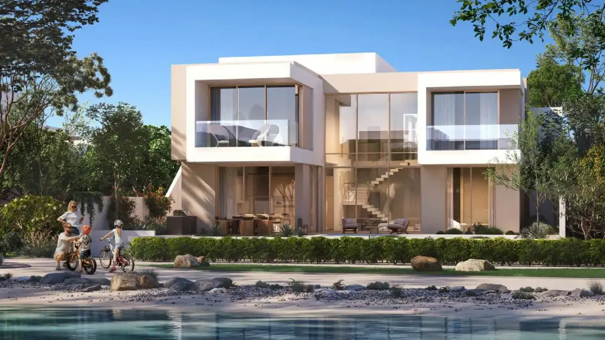 Palm-lined entrance boulevard leading to BAYN by ORA residences